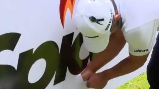 European Tour star gets golf ball stuck in sponsor sign, but what's the ruling?